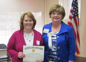 Catherine Snyder from East Holmes receives the Quinn Educational Scholarship for members from ECOEA VP Val Heban. Catherine also accepted the Quinn Educational Scholarship for Members' Children on behalf of her daughter Mallory.